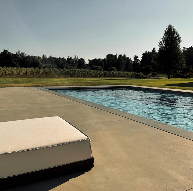 A pool overlooking a vineyard in Abbotsford BC